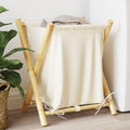 Ce panier a linge se presente en coloris blanc